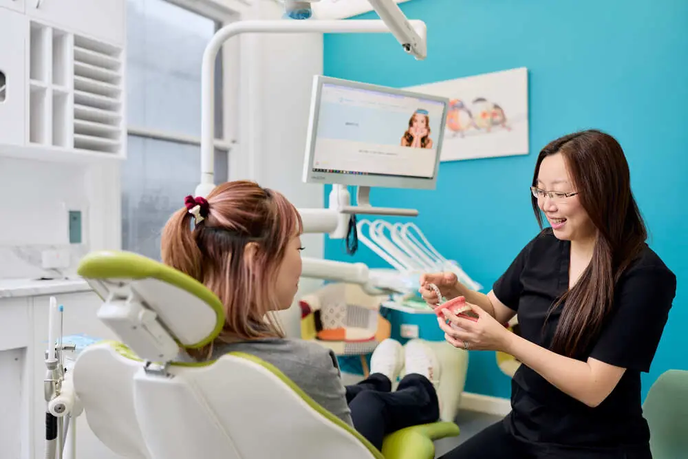 Dr Anna Chau with a patient in the treatment room