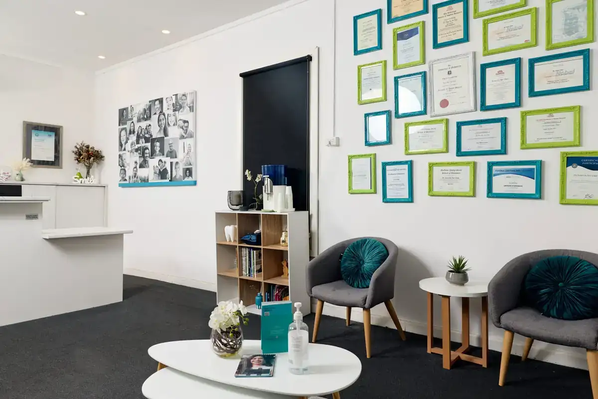 The Care Dental Camberwell waiting area, with qualifications and accreditation displayed